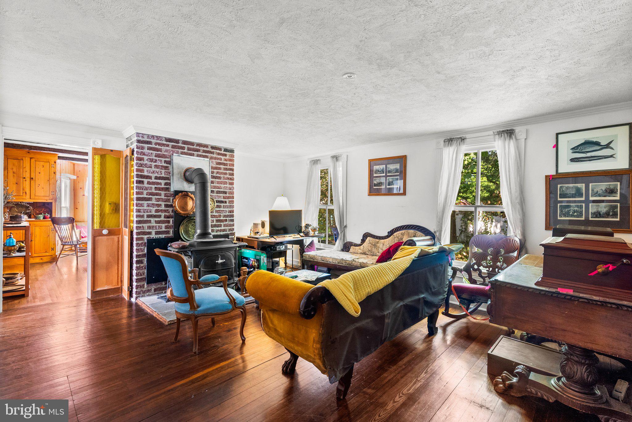 13321 Travilah Road Potomac, MD 20854 - Photo 12 of 43 a living room with furniture and a wooden floor