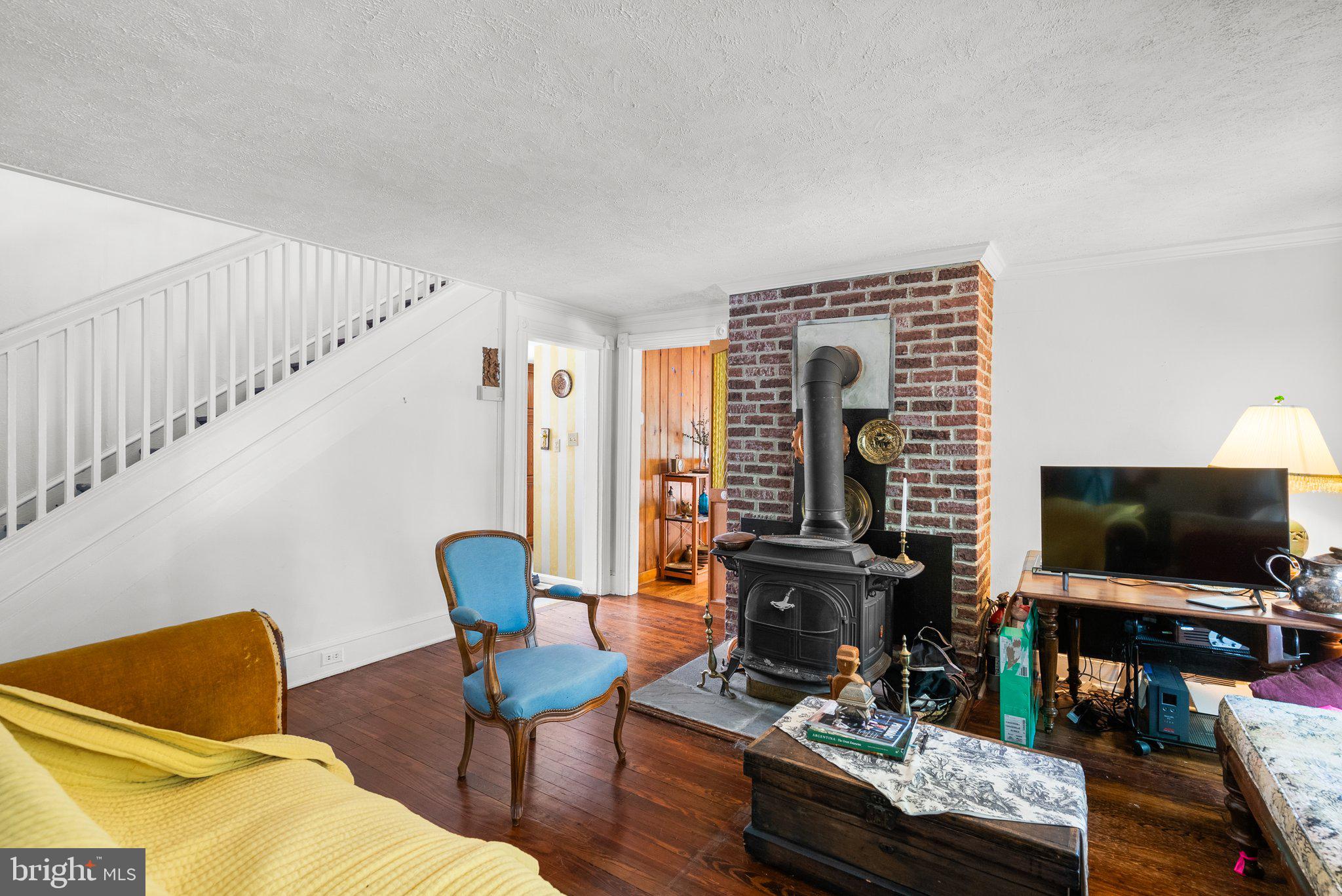 13321 Travilah Road Potomac, MD 20854 - Photo 13 of 43 a living room with furniture and a flat screen tv