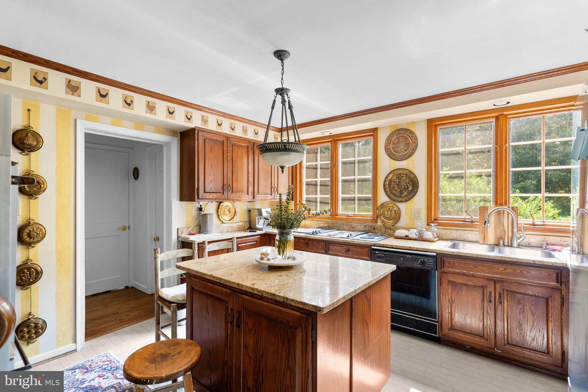13321 Travilah Road Potomac, MD 20854 - Photo 15 of 43 a kitchen with a sink stove and cabinets