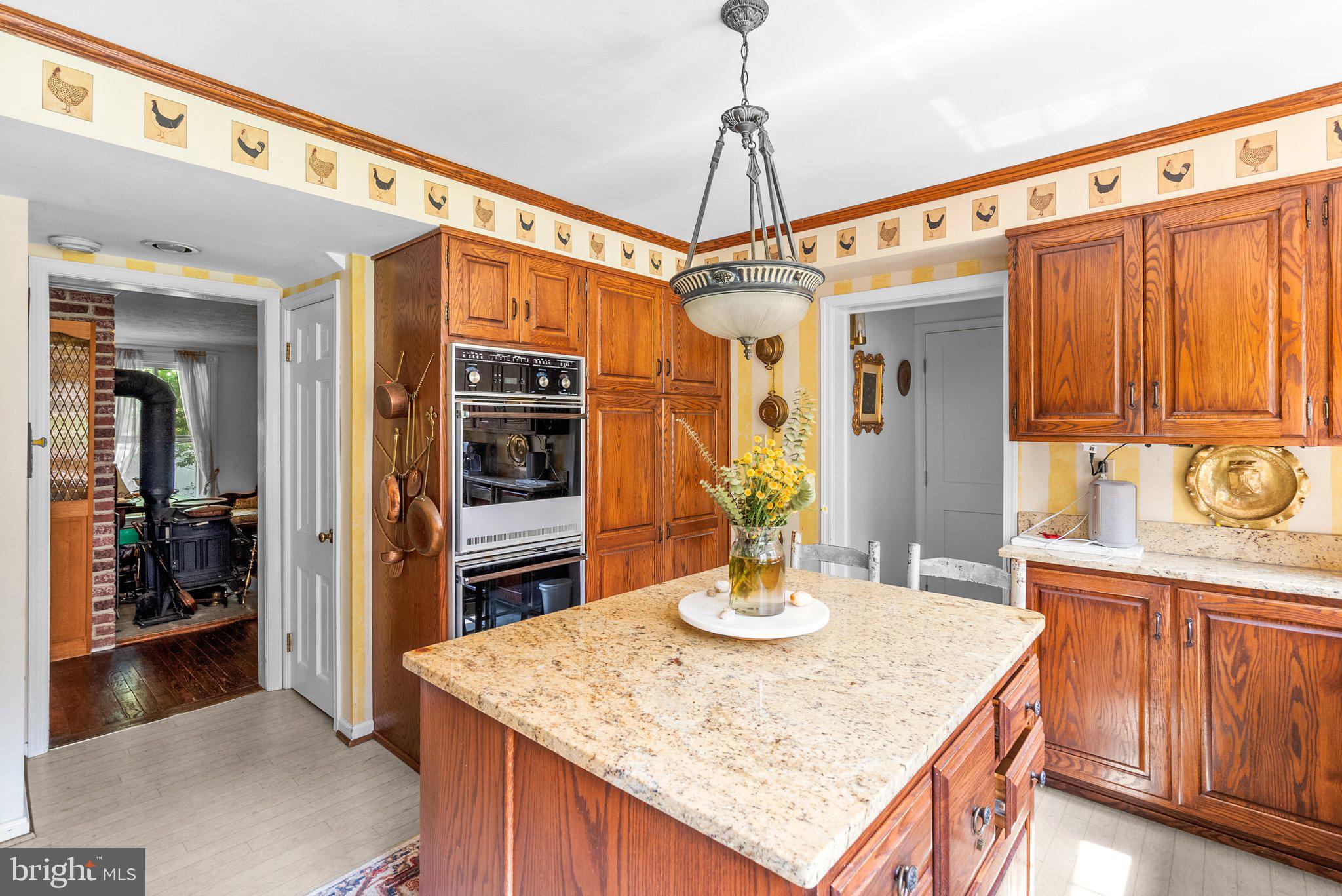 13321 Travilah Road Potomac, MD 20854 - Photo 16 of 43 a kitchen with a appliances a sink and cabinets