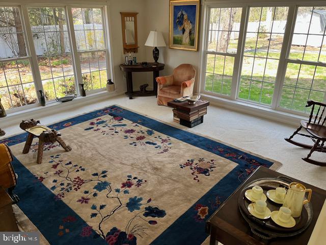 13321 Travilah Road Potomac, MD 20854 - Photo 20 of 43 a living room with a couch and a table
