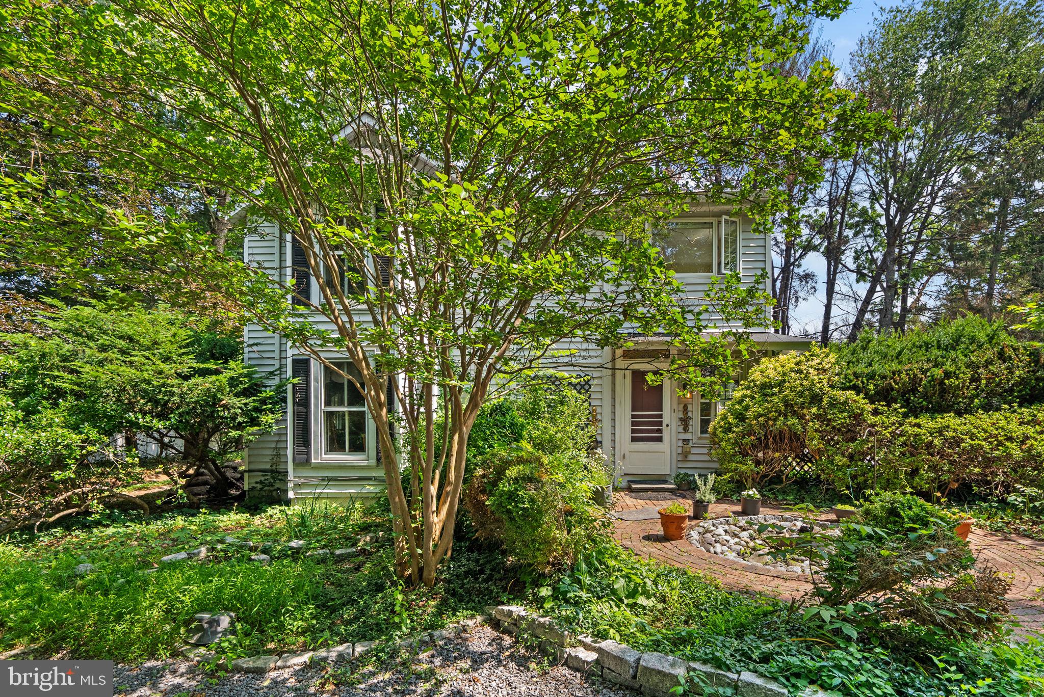 13321 Travilah Road Potomac, MD 20854 - Photo 2 of 43 front view of a house with a tree