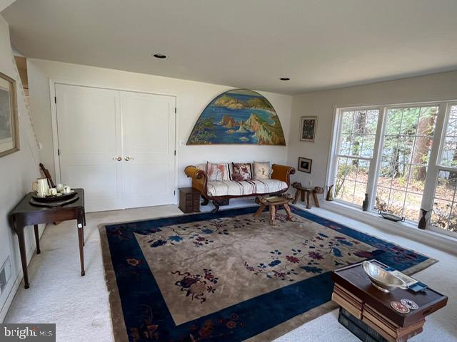 13321 Travilah Road Potomac, MD 20854 - Photo 21 of 43 a living room with a rug and a table