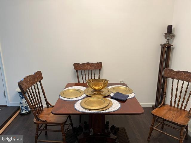 13321 Travilah Road Potomac, MD 20854 - Photo 22 of 43 a view of a dining room with furniture and wooden floor