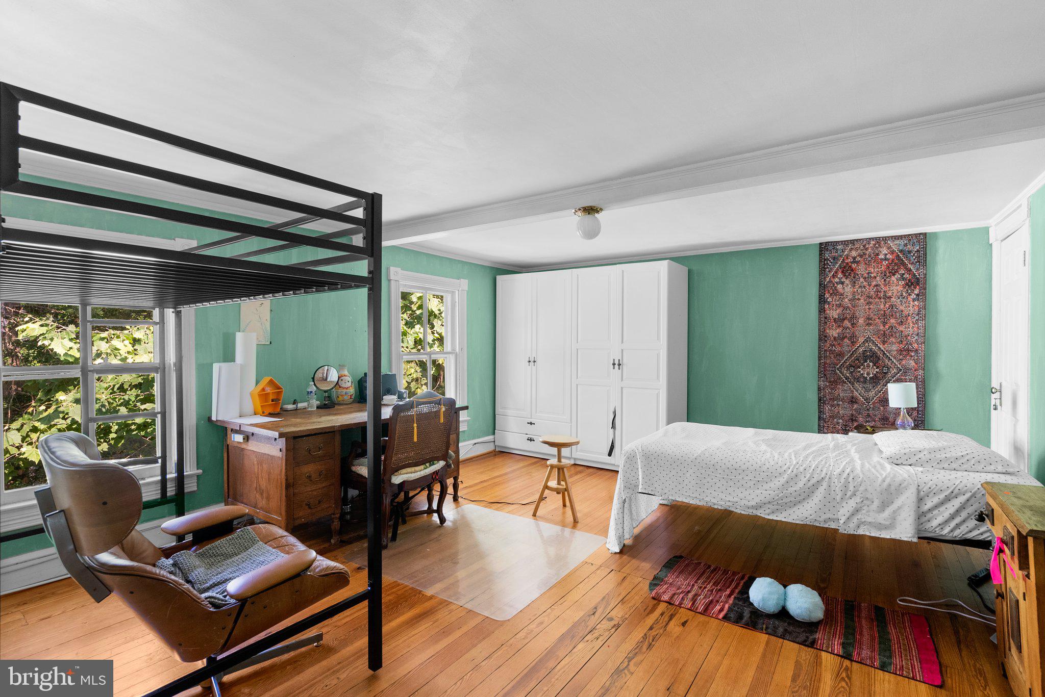 13321 Travilah Road Potomac, MD 20854 - Photo 25 of 43 a bedroom with furniture and a large window