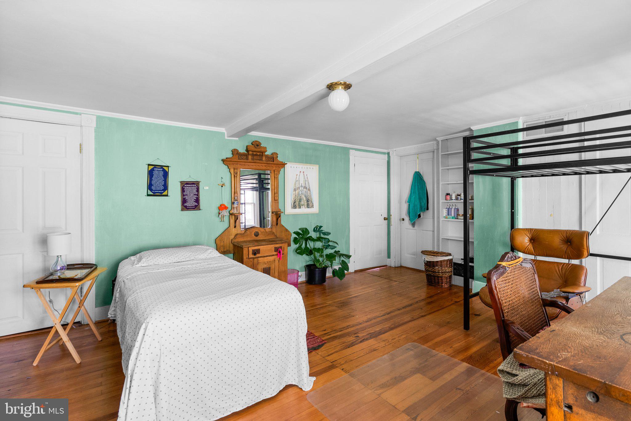 13321 Travilah Road Potomac, MD 20854 - Photo 27 of 43 a bedroom with a bed and wooden floor