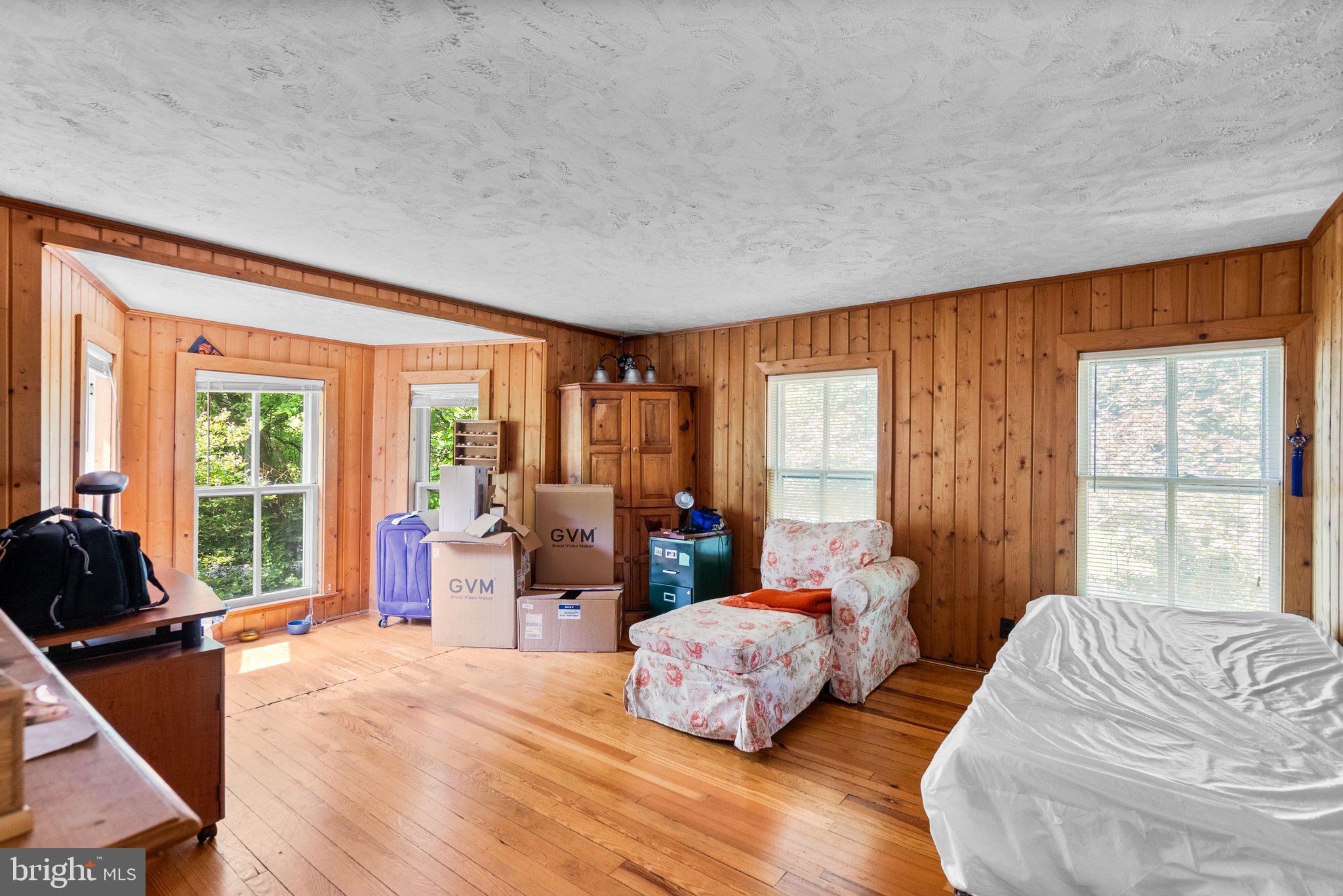 13321 Travilah Road Potomac, MD 20854 - Photo 28 of 43 a bedroom with a bed and large windows