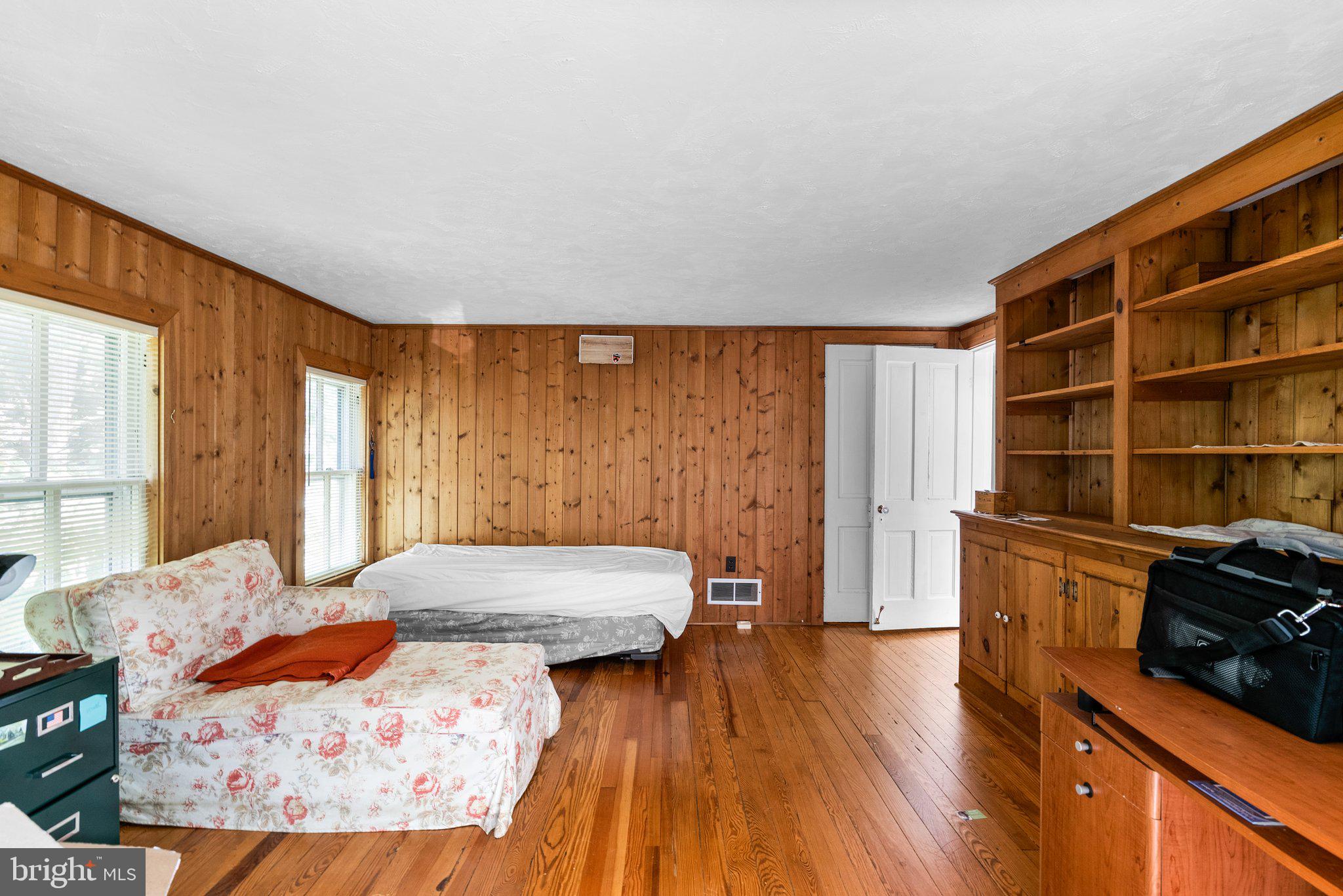 13321 Travilah Road Potomac, MD 20854 - Photo 29 of 43 a living room with furniture and wooden floor