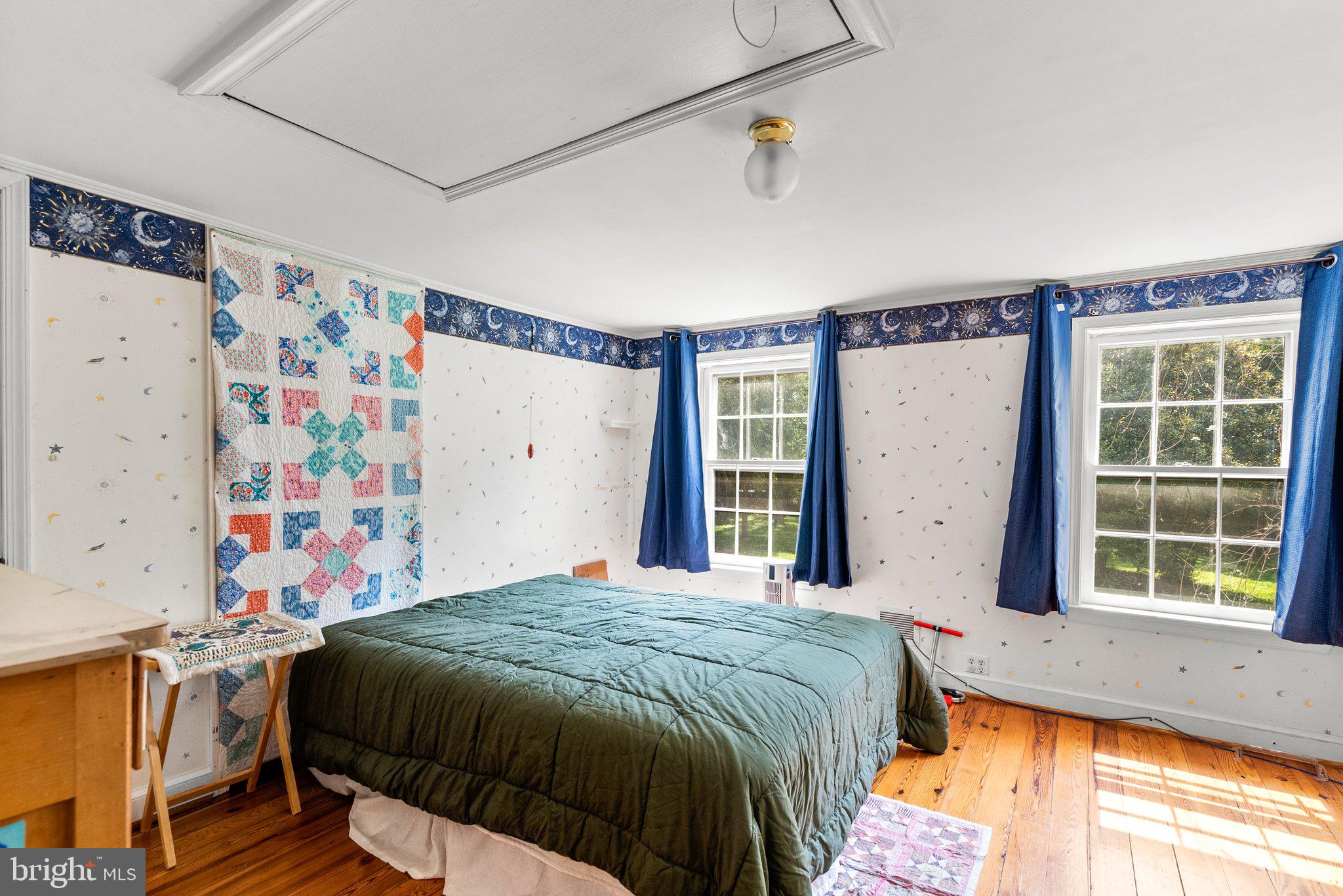 13321 Travilah Road Potomac, MD 20854 - Photo 30 of 43 a bedroom with a bed and a window