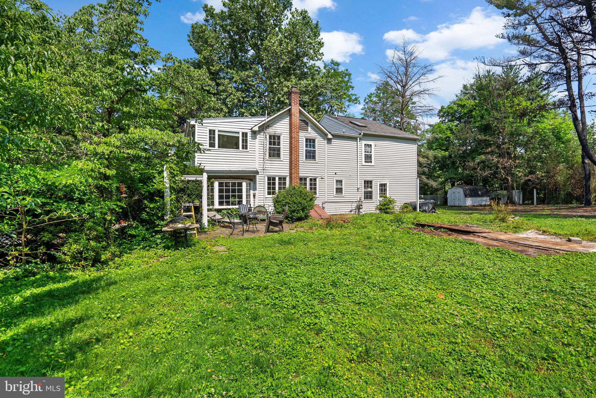 13321 Travilah Road Potomac, MD 20854 - Photo 38 of 43 a front view of house with yard and green space
