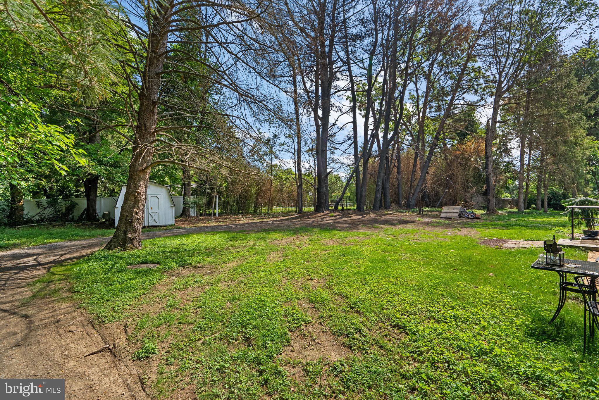13321 Travilah Road Potomac, MD 20854 - Photo 40 of 43 a view of outdoor space with deck and green space
