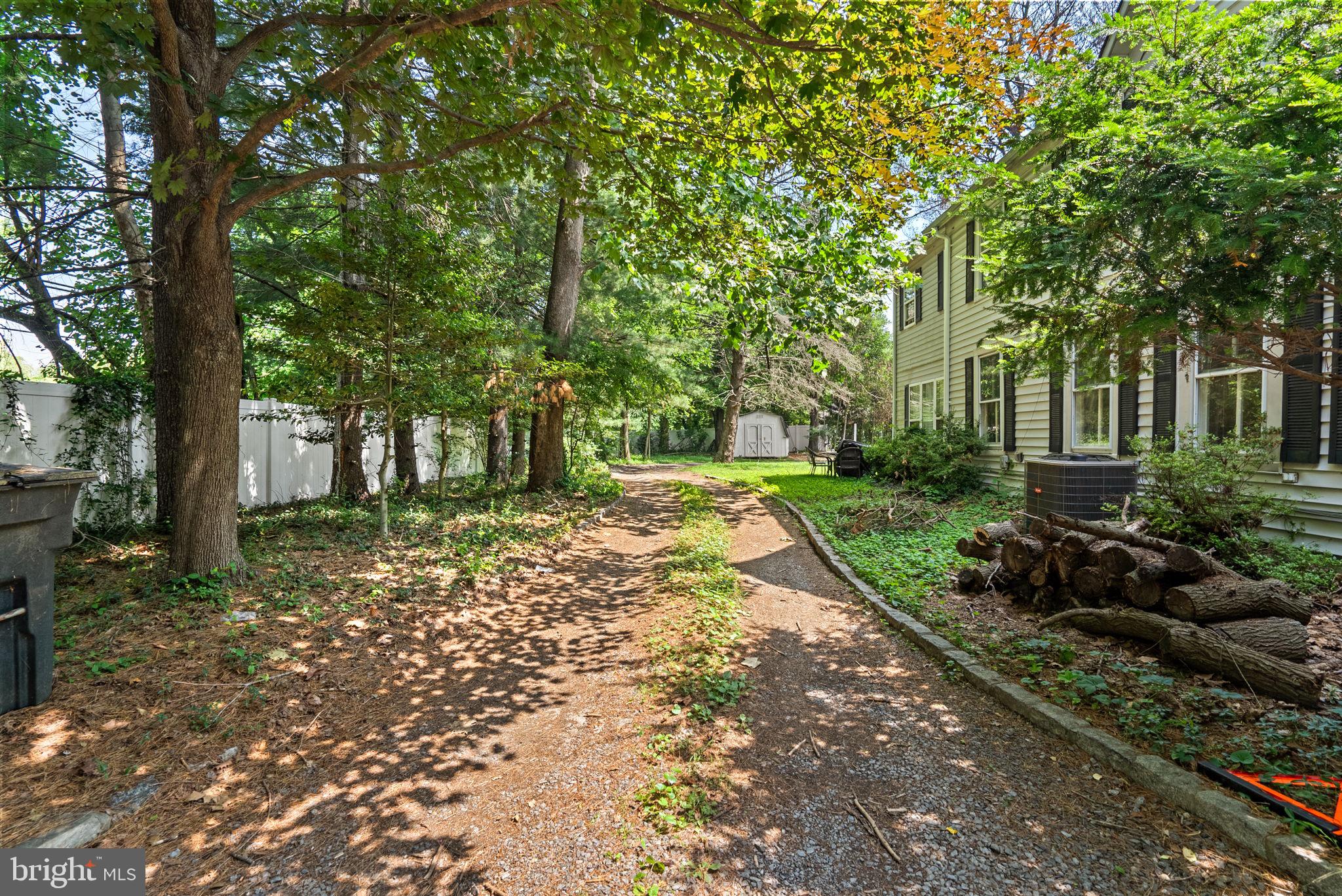 13321 Travilah Road Potomac, MD 20854 - Photo 4 of 43 a view of a house with a yard