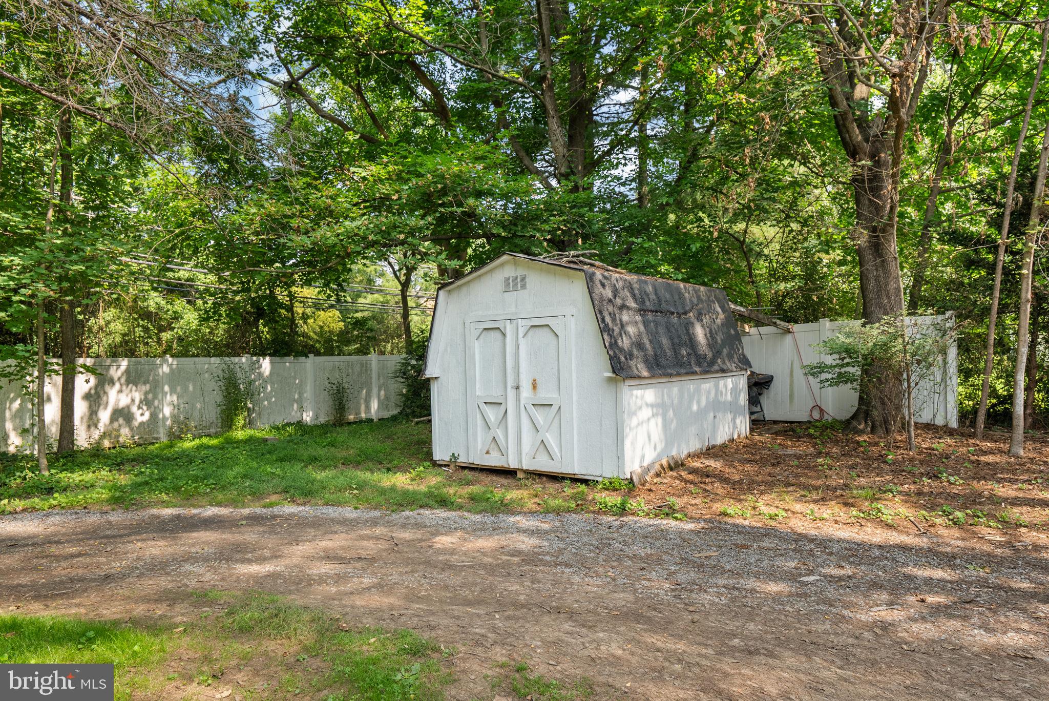 13321 Travilah Road Potomac, MD 20854 - Photo 41 of 43 a house view with a backyard space