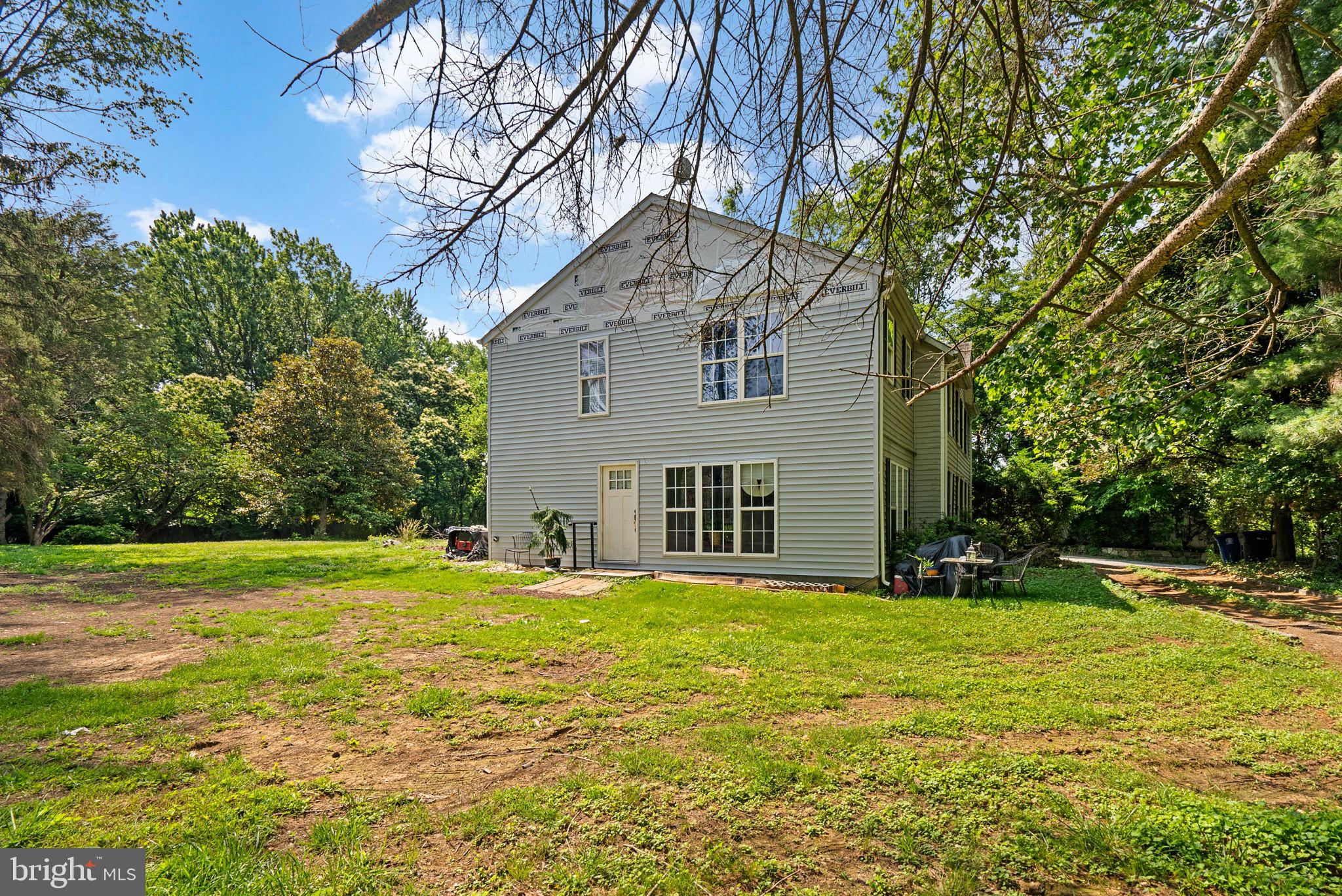 13321 Travilah Road Potomac, MD 20854 - Photo 42 of 43 a view of a house with a yard and trees