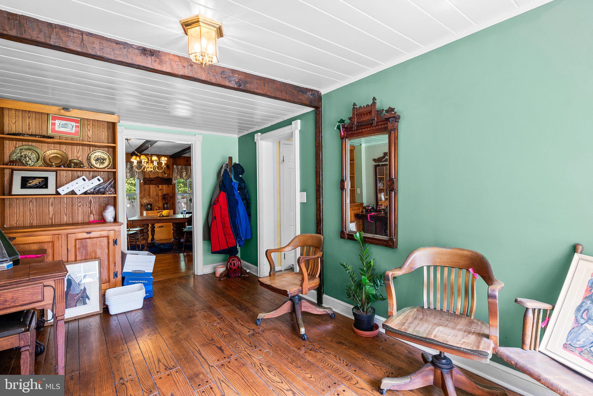 13321 Travilah Road Potomac, MD 20854 - Photo 8 of 43 a view of game room with furniture and wooden floor