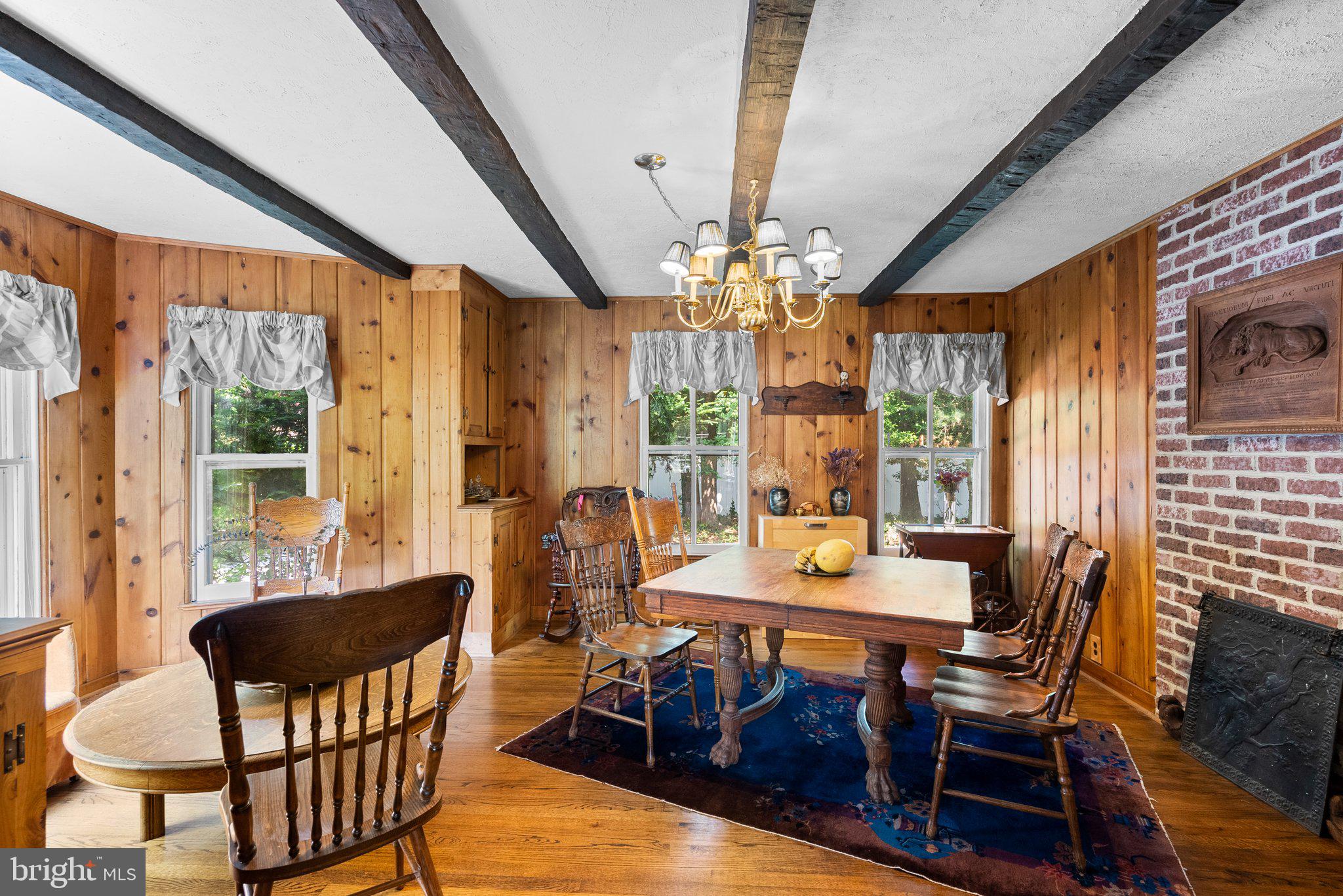 13321 Travilah Road Potomac, MD 20854 - Photo 10 of 43 a view of a dining room with furniture wooden floor and chandelier