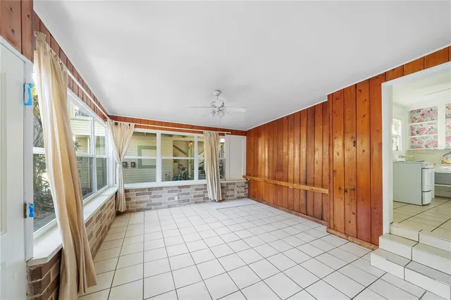 a view of an entryway with wooden floor and windows