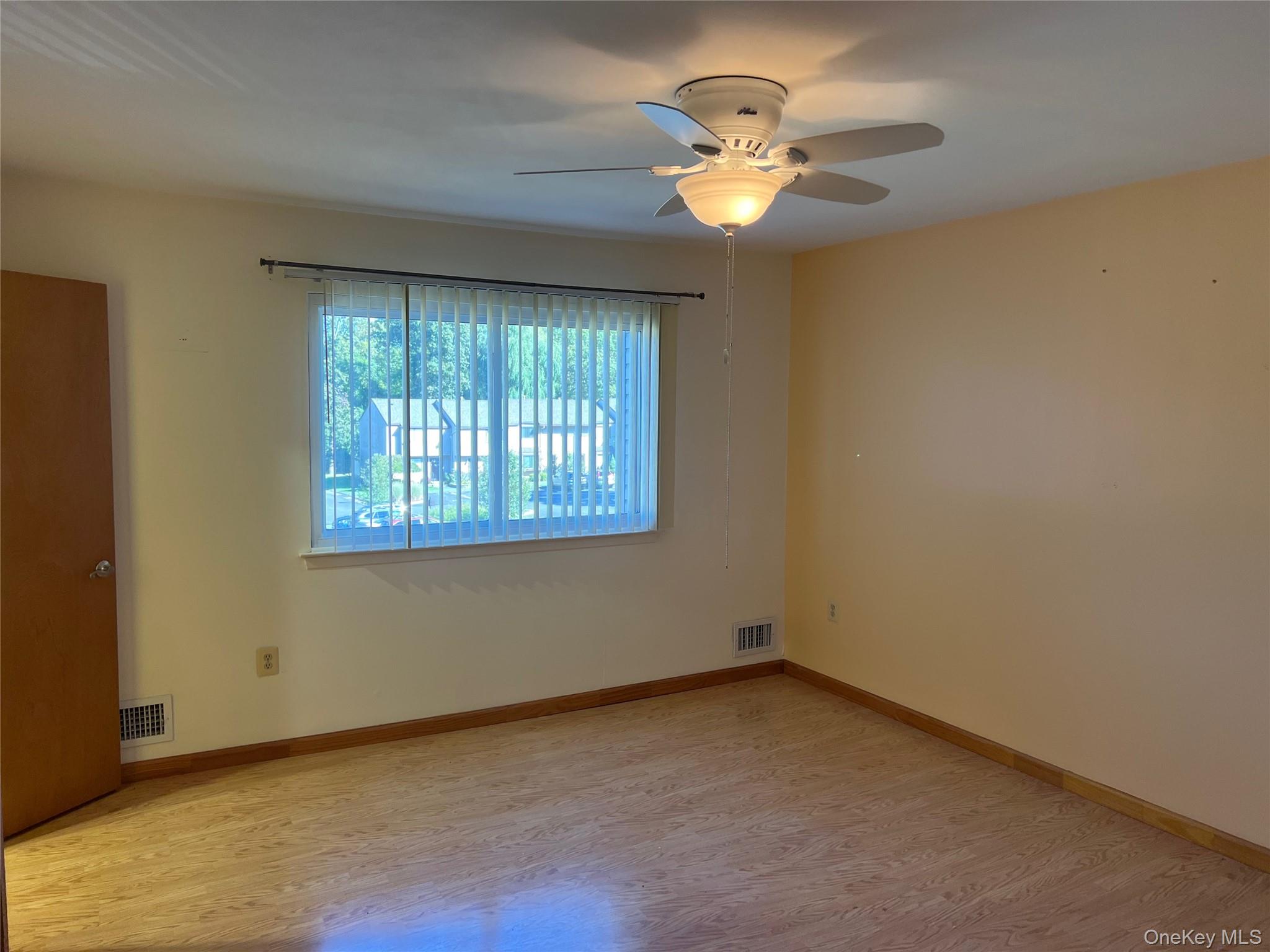 10 Squires Gate, Unit H Poughkeepsie, NY 12603 - Photo 12 of 24 an empty room with a window