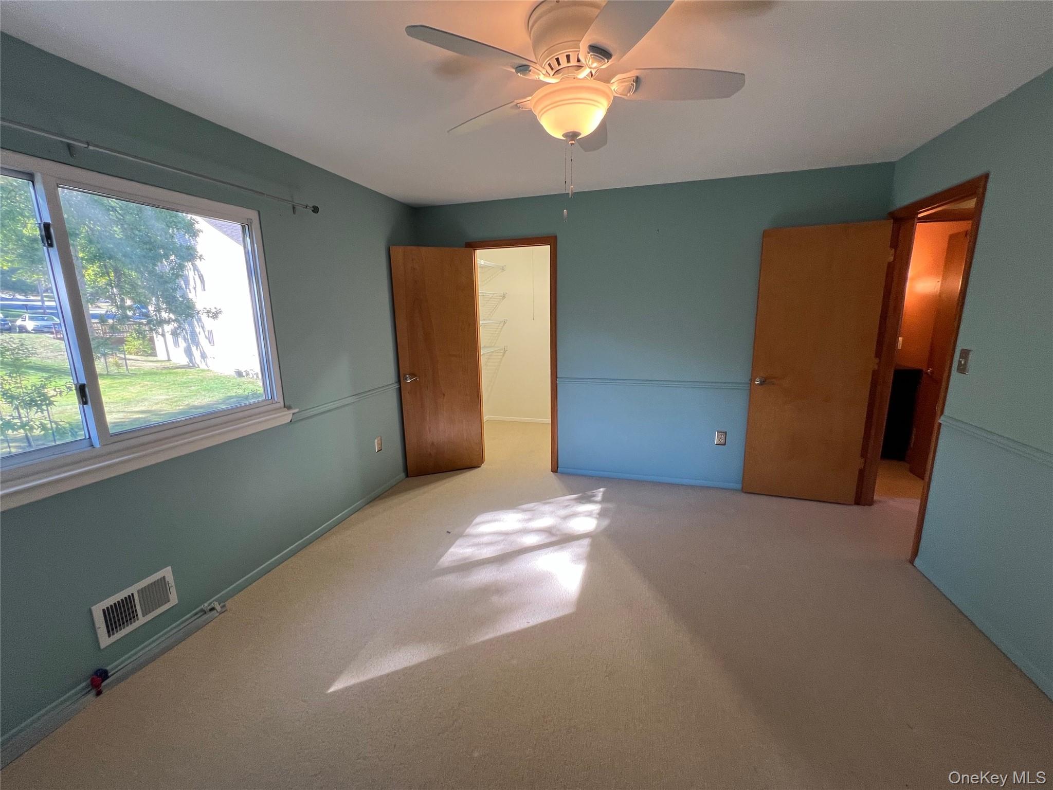 10 Squires Gate, Unit H Poughkeepsie, NY 12603 - Photo 14 of 24 a view of an empty room with a window