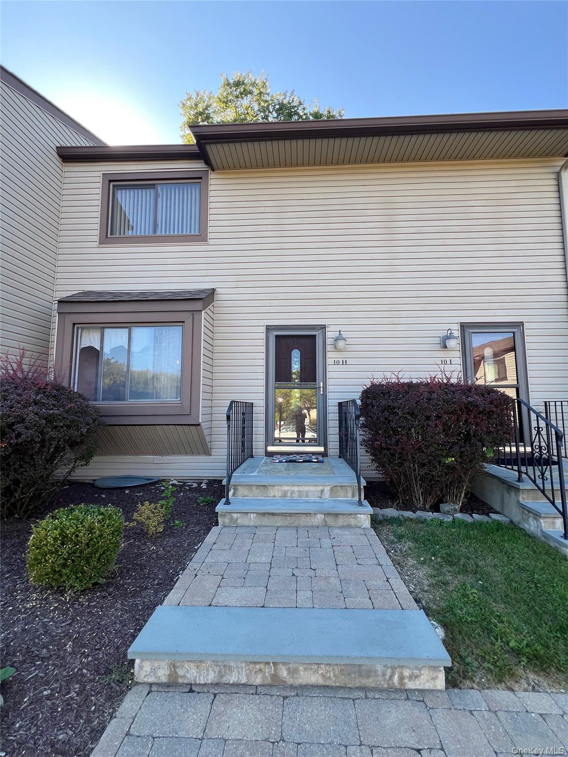 10 Squires Gate, Unit H Poughkeepsie, NY 12603 - Photo 21 of 24 a front view of a house with garden