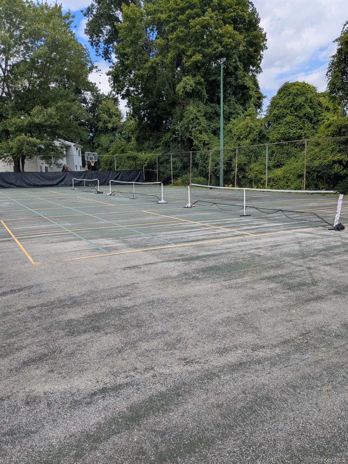 10 Squires Gate, Unit H Poughkeepsie, NY 12603 - Photo 24 of 24 a view of a tennis court