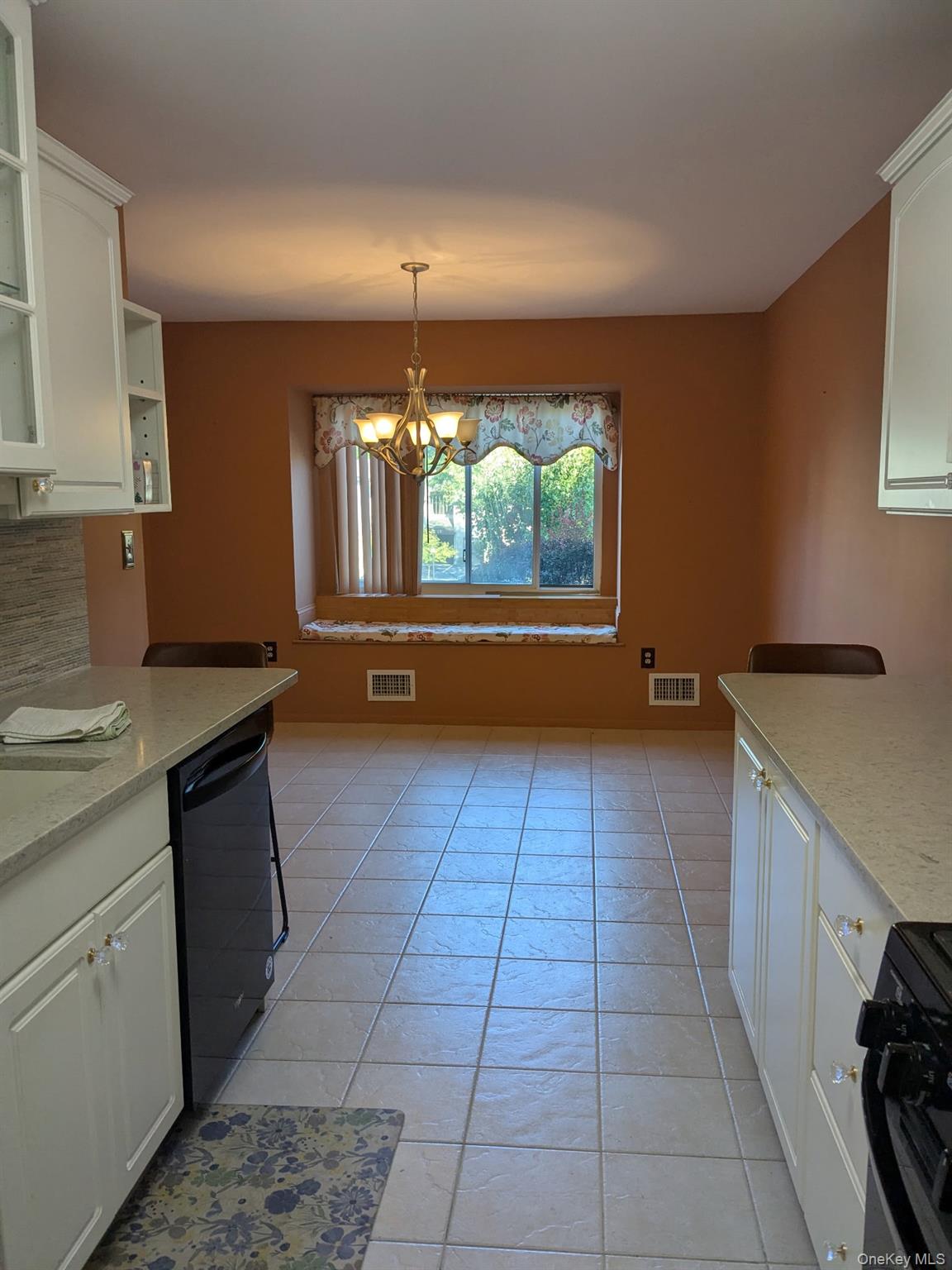 10 Squires Gate, Unit H Poughkeepsie, NY 12603 - Photo 4 of 24 a kitchen with a sink a counter top space and appliances