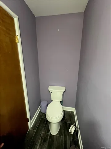 a bathroom with a toilet and a sink
