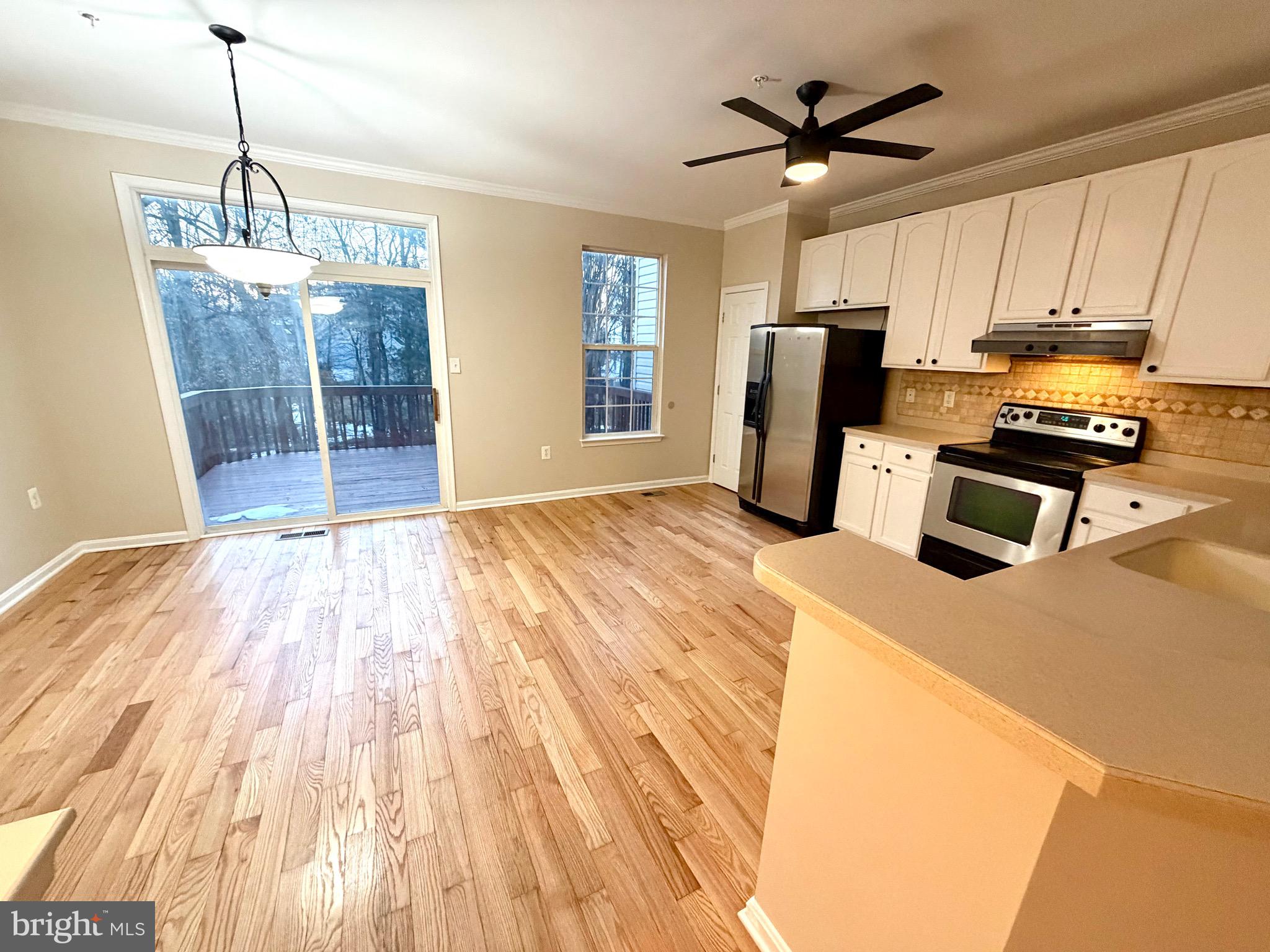 10158 Tree Frog Place White Plains, MD 20695 - Photo 13 of 25 a kitchen with stainless steel appliances a refrigerator sink and microwave