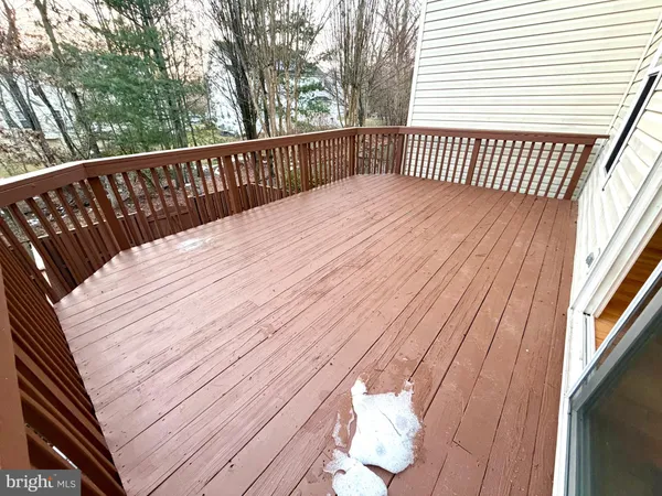 a balcony with a wooden floor
