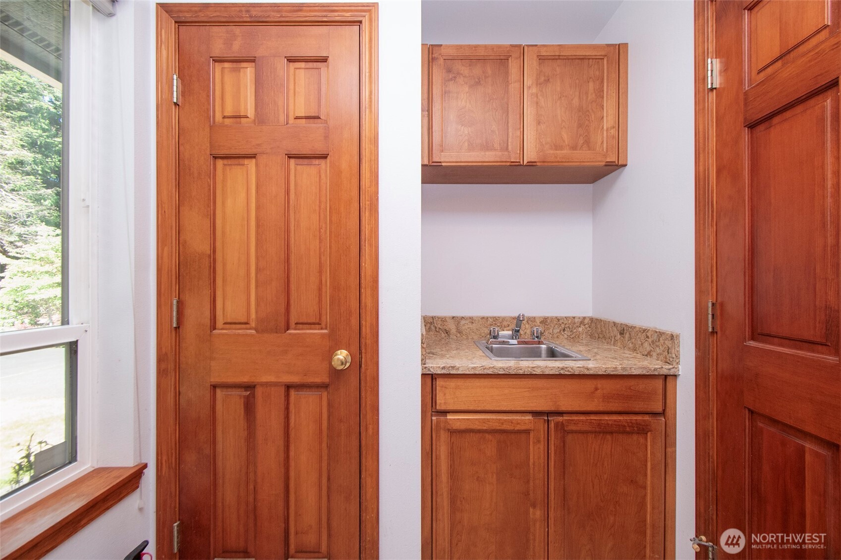 99 South Point Road Port Angeles, WA 98363 - Photo 9 of 40 a bathroom with a granite countertop sink and a mirror