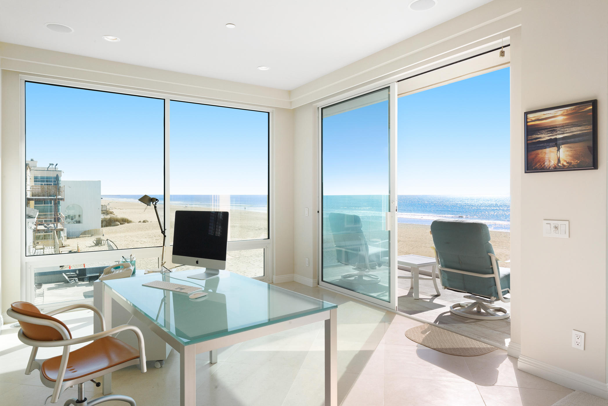 1135 Capri Way Oxnard, CA 93035 - Photo 38 of 50 a work room with furniture a flat screen tv and a floor to ceiling window