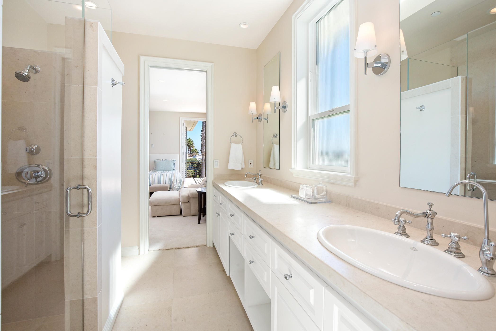 1135 Capri Way Oxnard, CA 93035 - Photo 44 of 50 a en suite bathroom with a double vanity sink a mirror and a shower