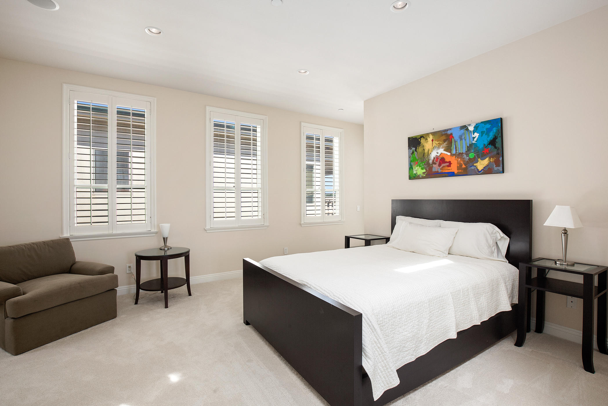 1135 Capri Way Oxnard, CA 93035 - Photo 45 of 50 a bedroom with a bed and a couch