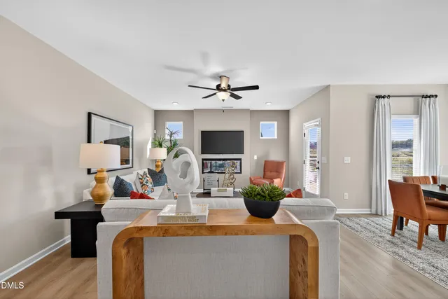 a view of a dining room with furniture and a fireplace