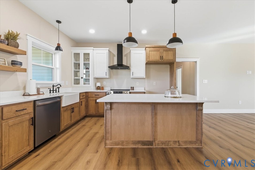1602 Lansing Road Petersburg, VA 23805 - Photo 12 of 30 a large kitchen with stainless steel appliances granite countertop a sink a stove and a wooden floor