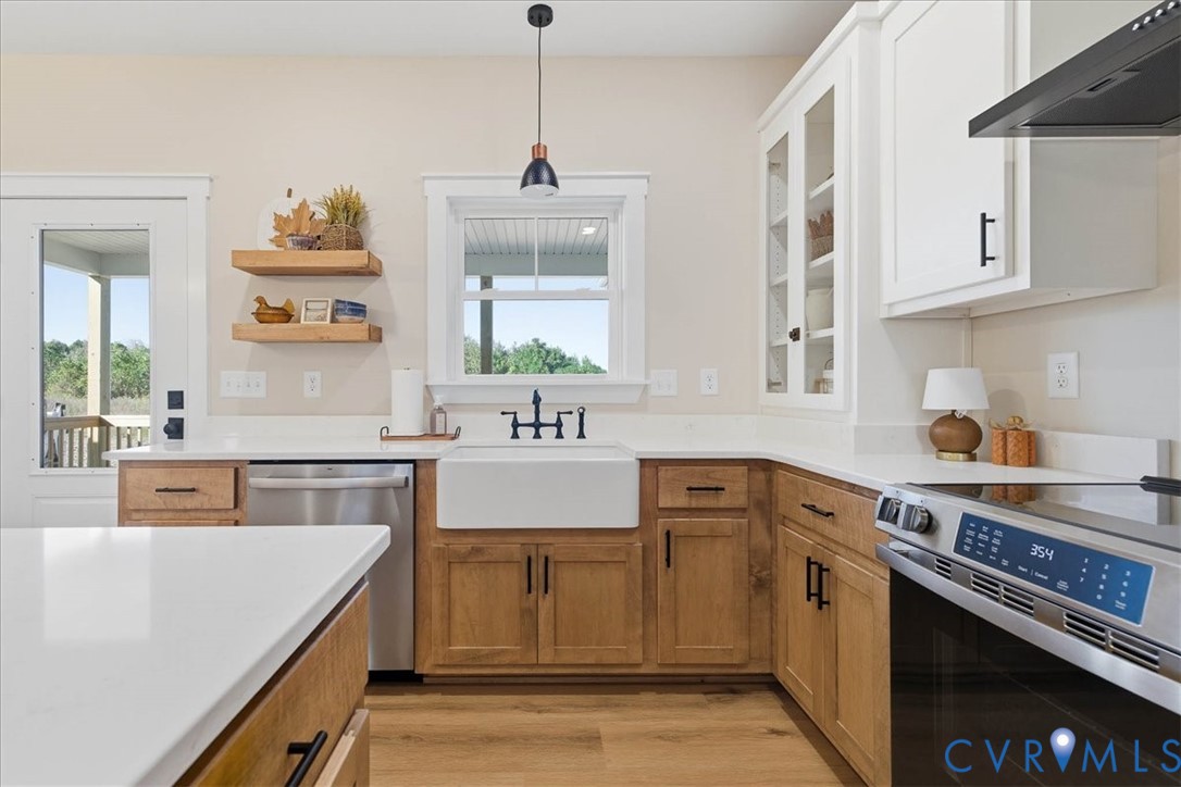1602 Lansing Road Petersburg, VA 23805 - Photo 14 of 30 a kitchen with stainless steel appliances granite countertop a sink stove and cabinets