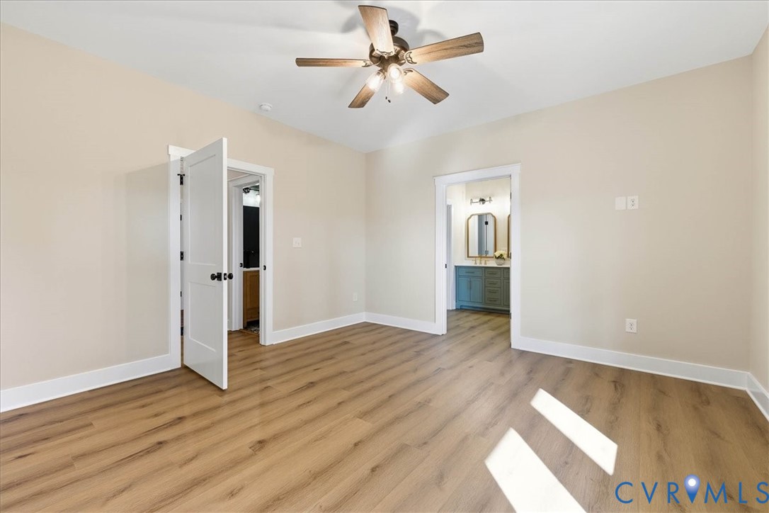 1602 Lansing Road Petersburg, VA 23805 - Photo 17 of 30 a view of an empty room with window and wooden floor