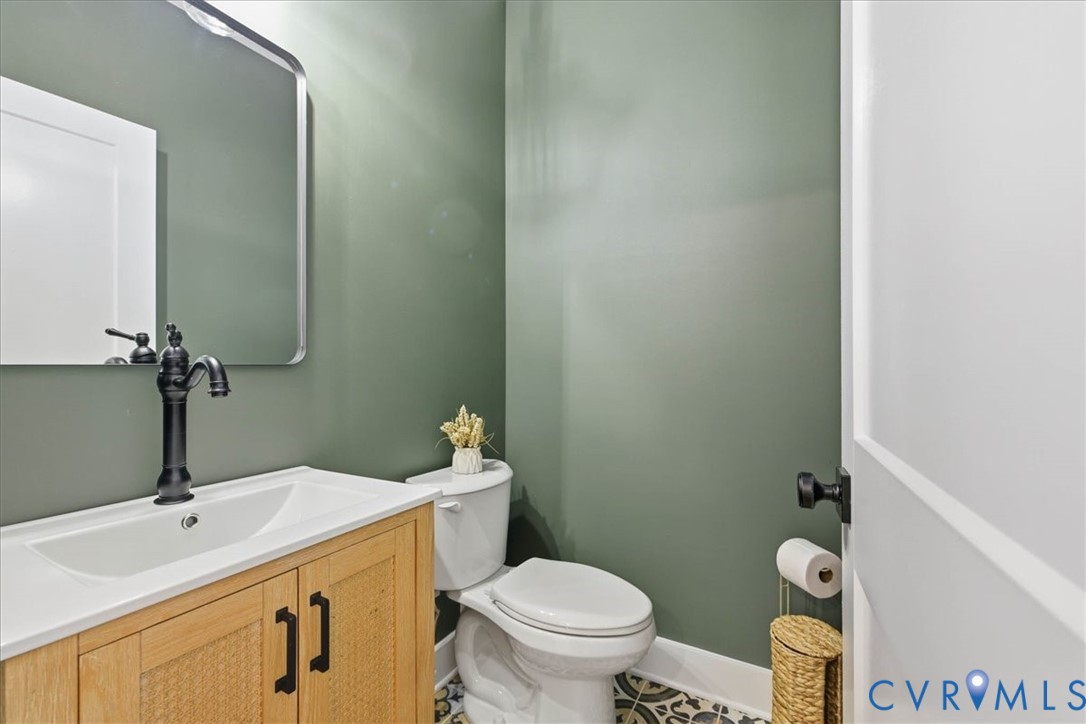 1602 Lansing Road Petersburg, VA 23805 - Photo 21 of 30 a bathroom with a toilet sink and mirror