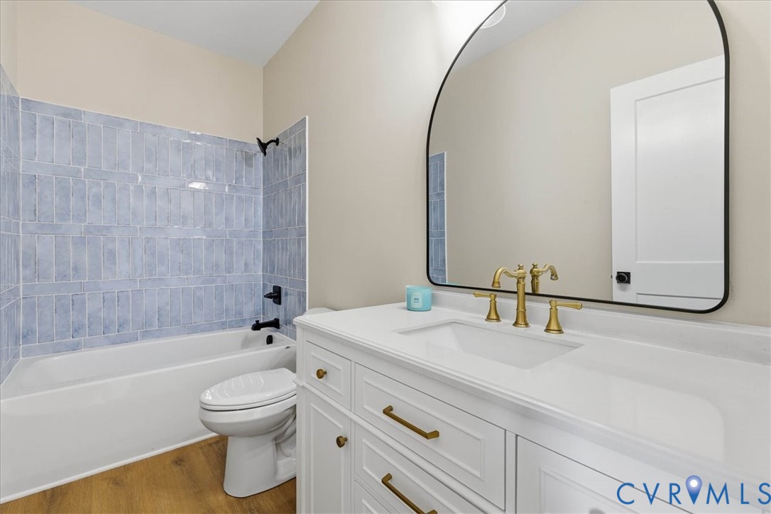 1602 Lansing Road Petersburg, VA 23805 - Photo 27 of 30 a bathroom with a sink and a mirror