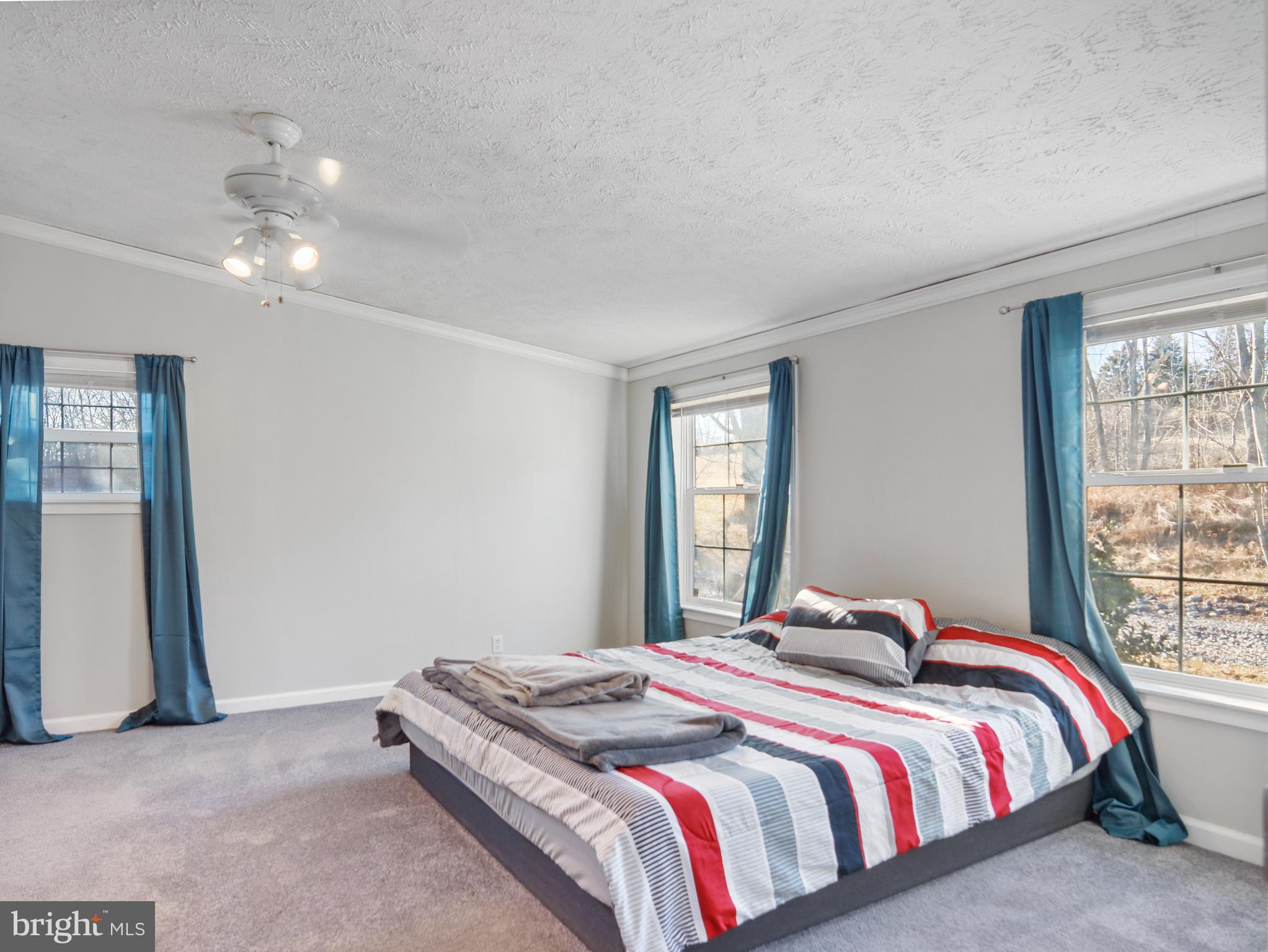 108 Rebel Drive Falling Waters, WV 25419 - Photo 17 of 27 a bedroom with a bed and window