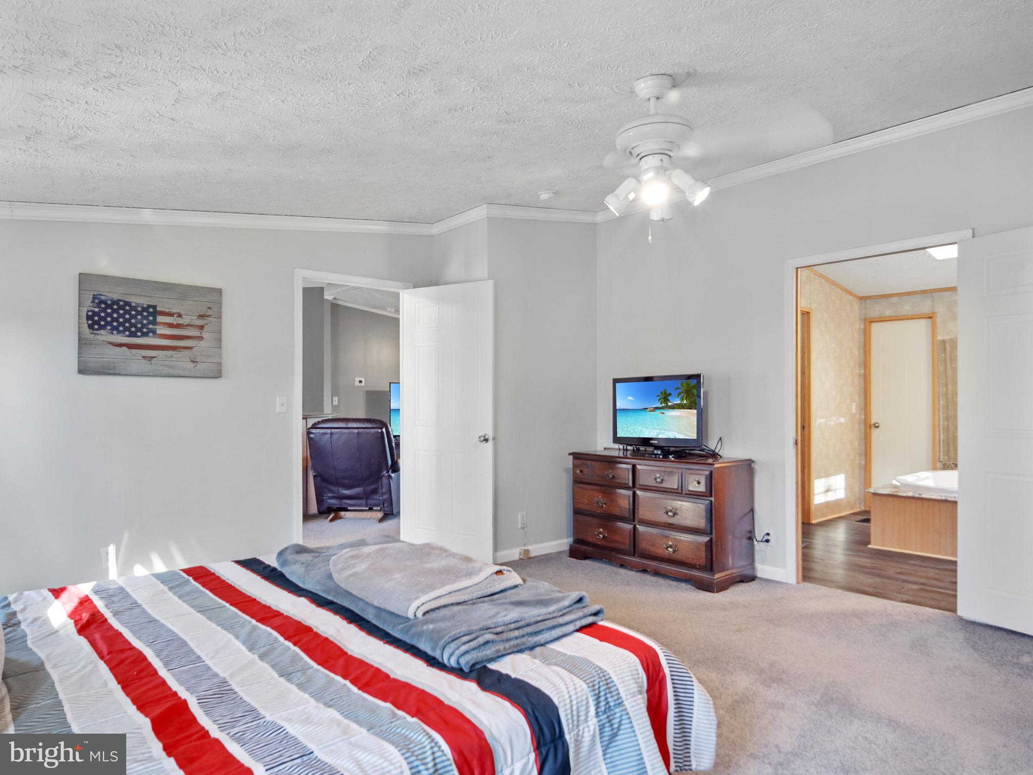 108 Rebel Drive Falling Waters, WV 25419 - Photo 18 of 27 a bedroom with a bed and furniture