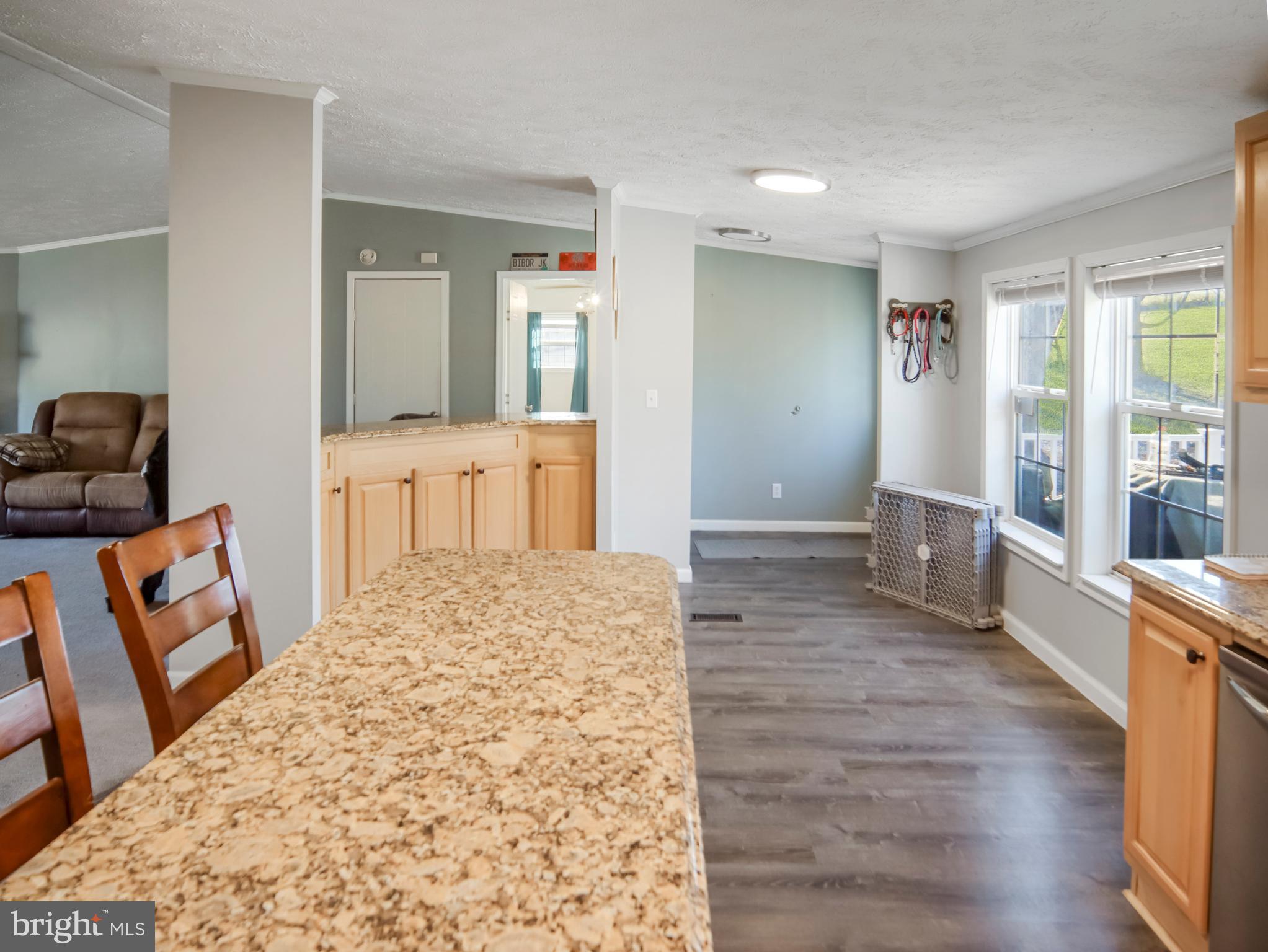 108 Rebel Drive Falling Waters, WV 25419 - Photo 23 of 27 a large bedroom with wooden floor and furniture