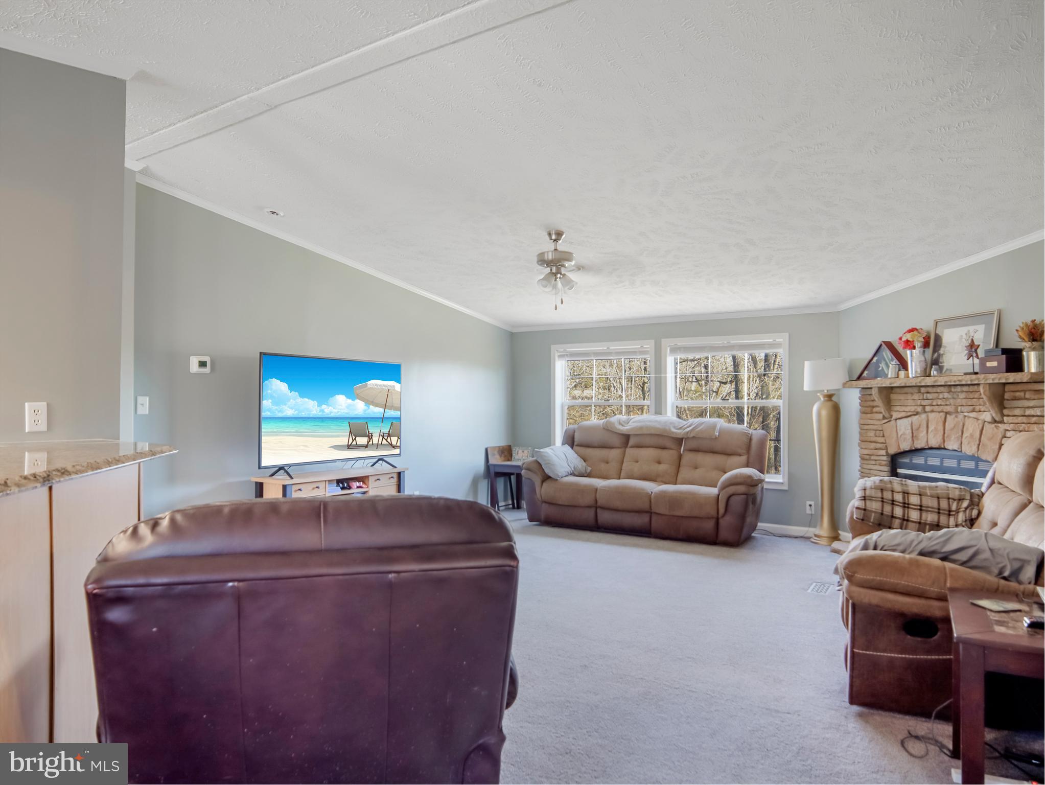 108 Rebel Drive Falling Waters, WV 25419 - Photo 24 of 27 a living room with furniture and a flat screen tv