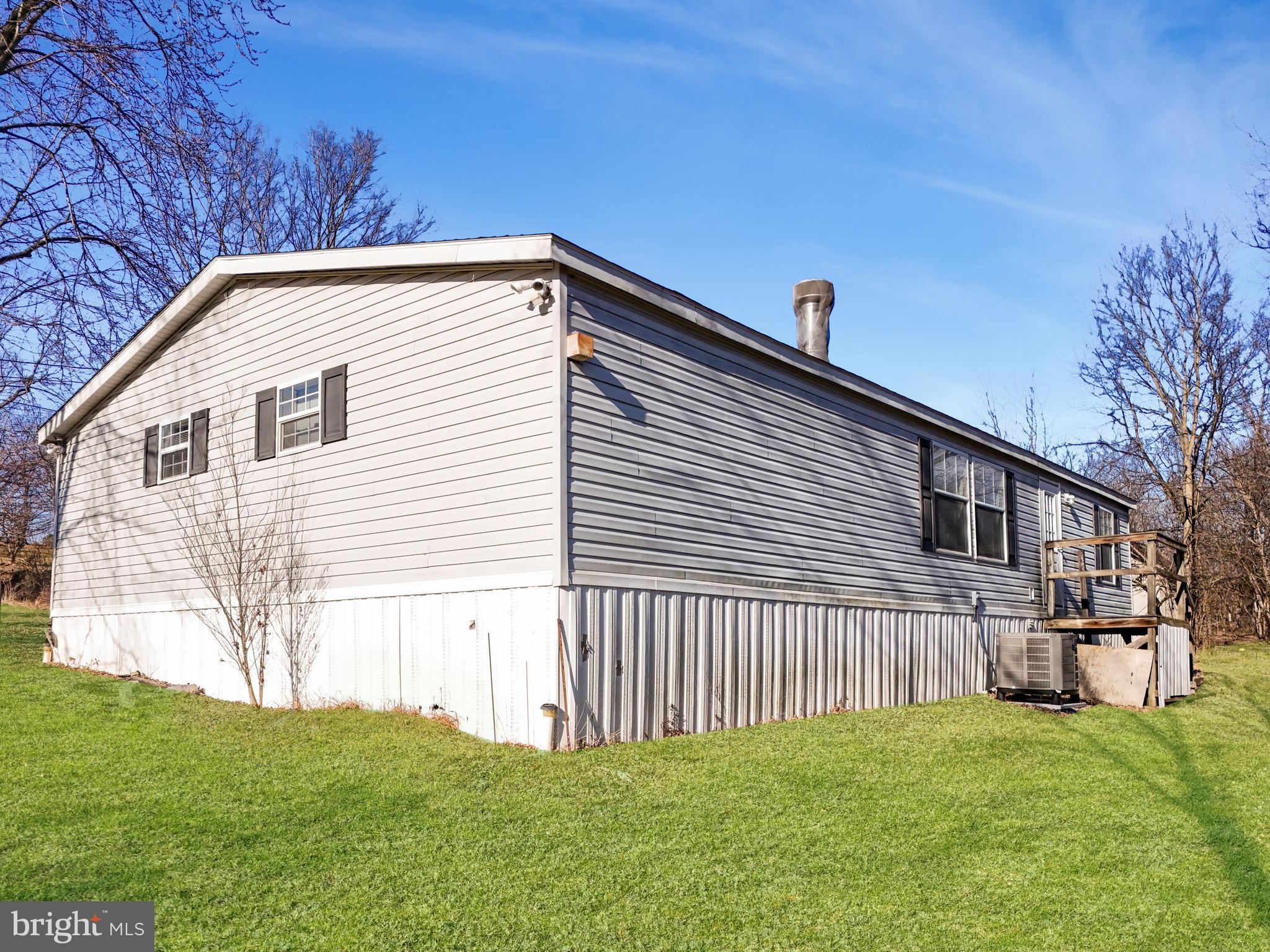 108 Rebel Drive Falling Waters, WV 25419 - Photo 3 of 27 a view of backyard with a house