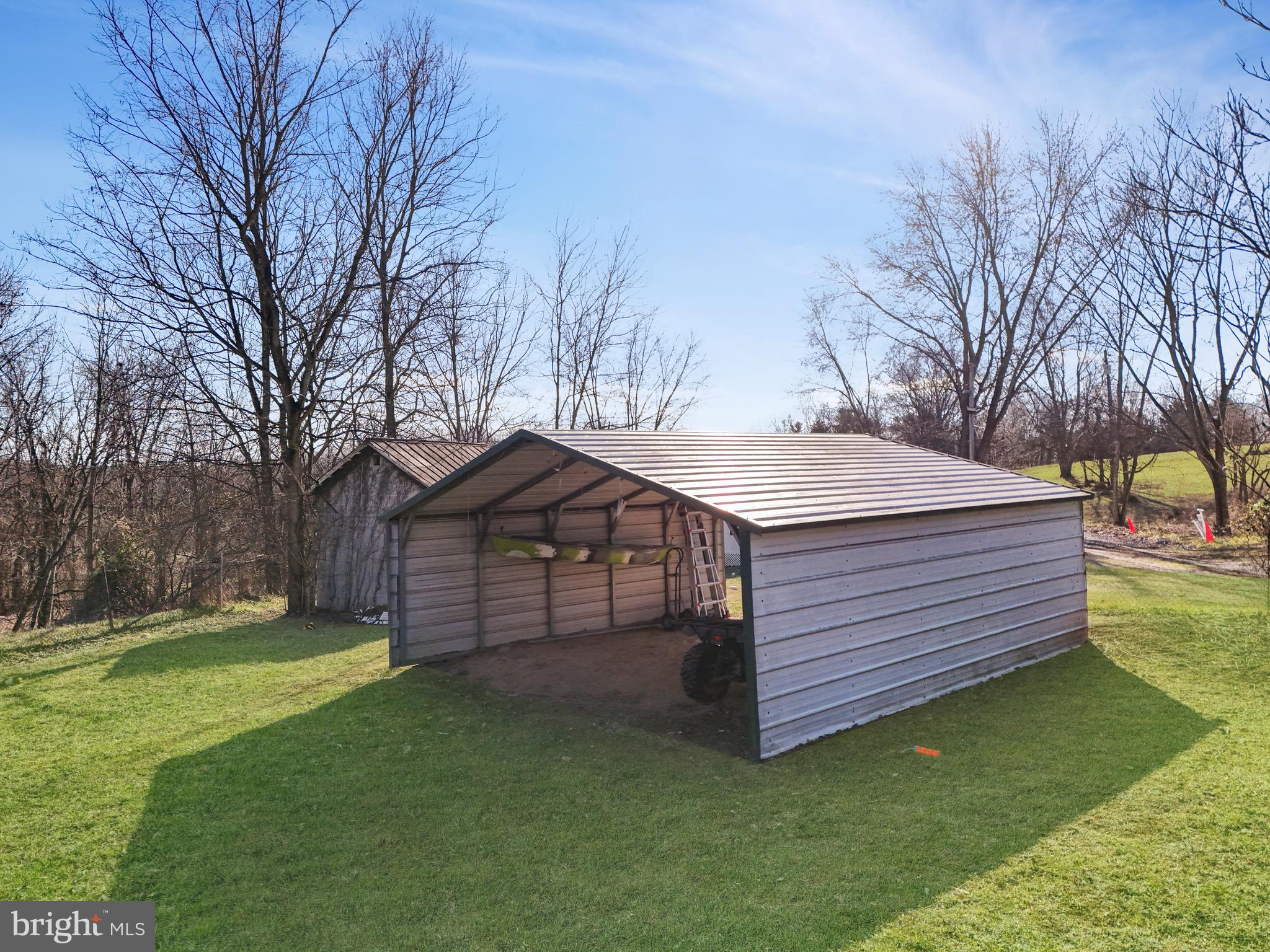 108 Rebel Drive Falling Waters, WV 25419 - Photo 5 of 27 a front view of a house with a garden