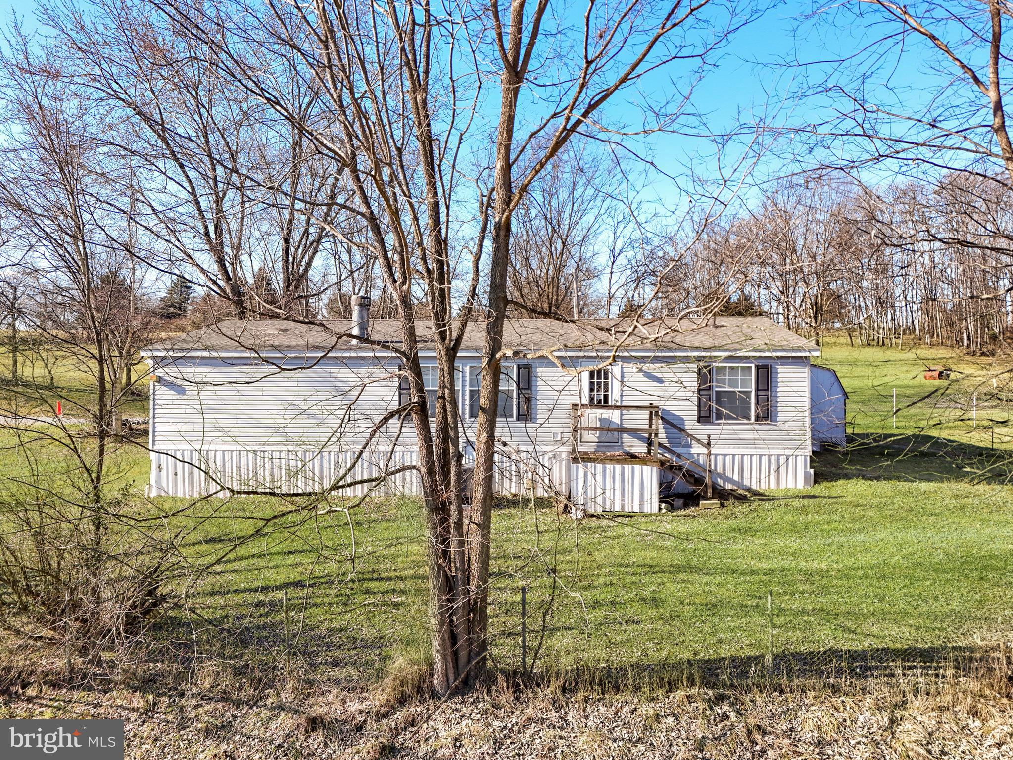 108 Rebel Drive Falling Waters, WV 25419 - Photo 6 of 27 a front view of a house with garden