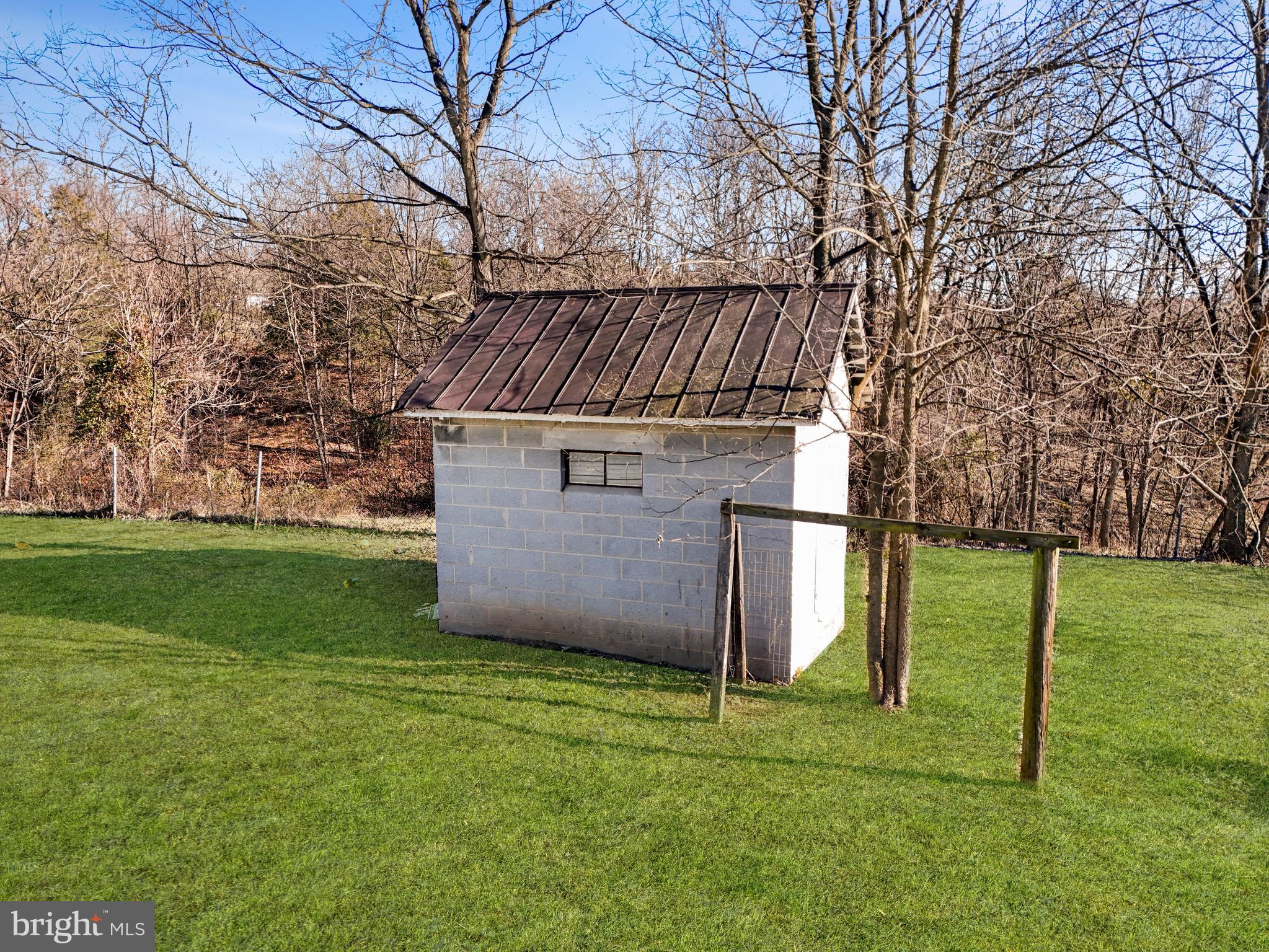 108 Rebel Drive Falling Waters, WV 25419 - Photo 7 of 27 a view of backyard with trampoline