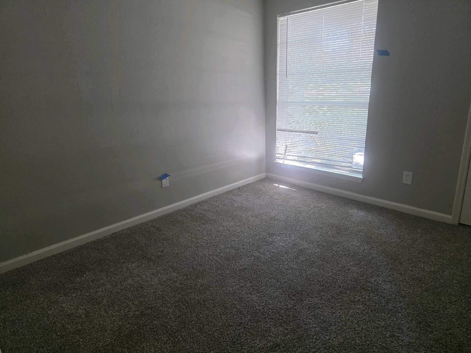 5006 Timber Ridge Street Baytown, TX 77521 - Photo 3 of 6 an empty room with a empty space and windows