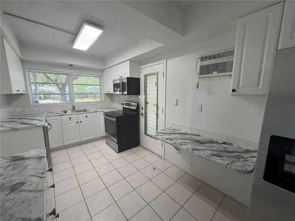 a bathroom with a sink and a window