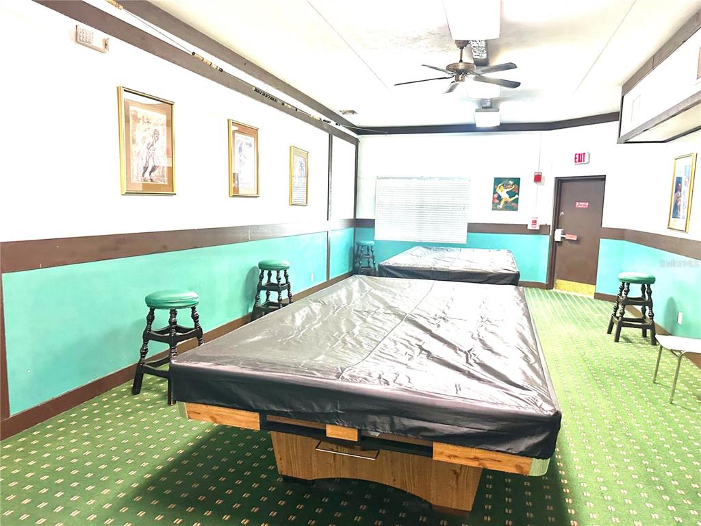 3760 Inverrary Drive, Unit 2M Lauderhill, FL 33319 - Photo 17 of 20 a room with pool table and windows